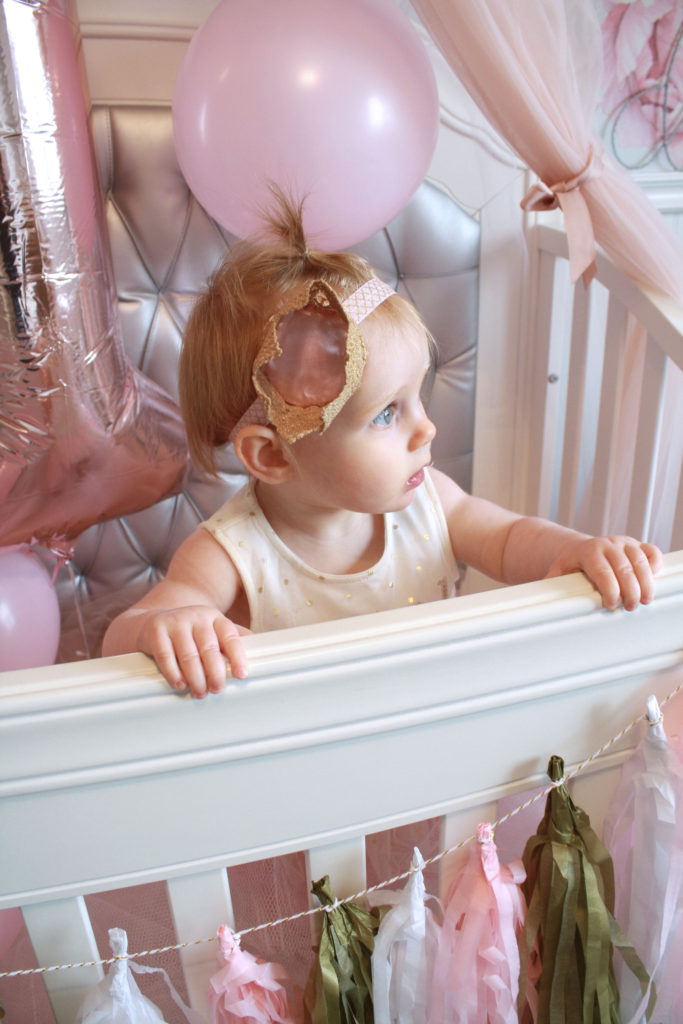 Easy first birthday ideas: Birthday princess enjoys her crib decorated for her first birthday