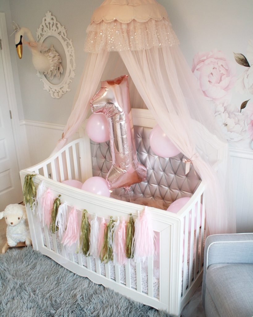 Easy first birthday ideas: Nursery and crib decorated for baby's first birthday