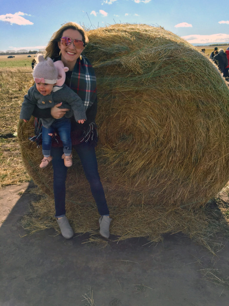 Prairie Gardens & Adventure Farm Haunted Pumpkin Festival - posing at a hay bale