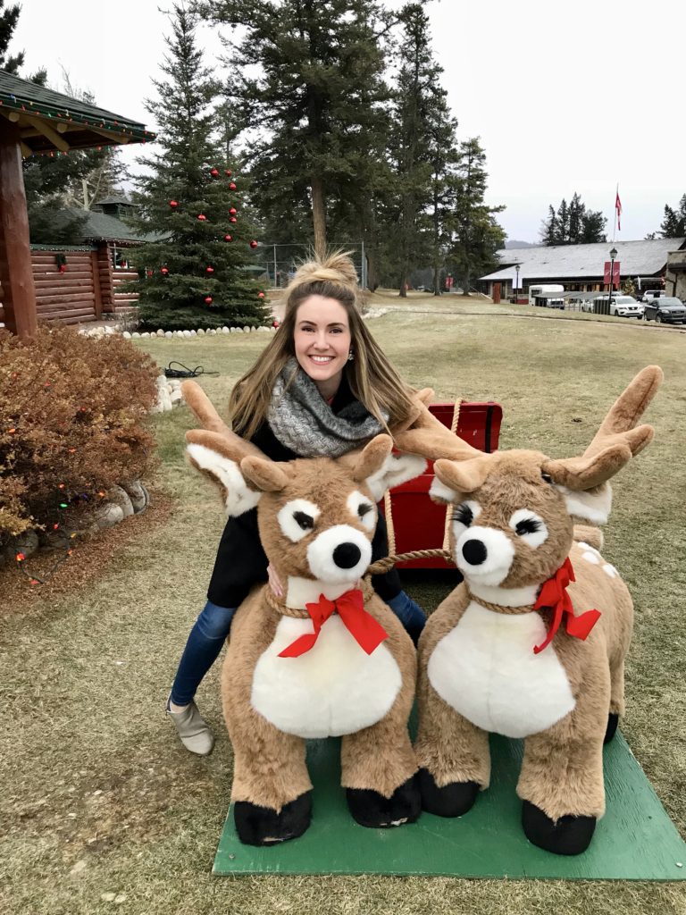 A sleigh of reindeer outside the man cabin at Christmas in November at Fairmont Jasper Park Lodge