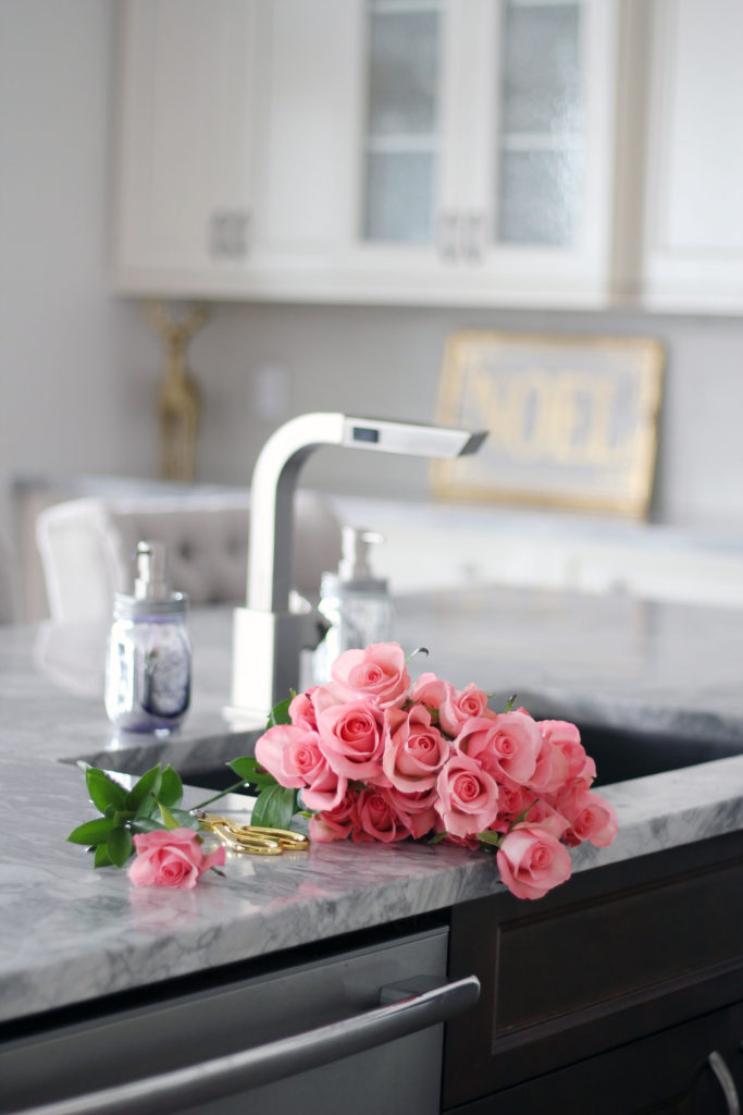 Fresh pink roses in white kitchen - Glam Christmas Home Tour - Chandeliers and Champagne