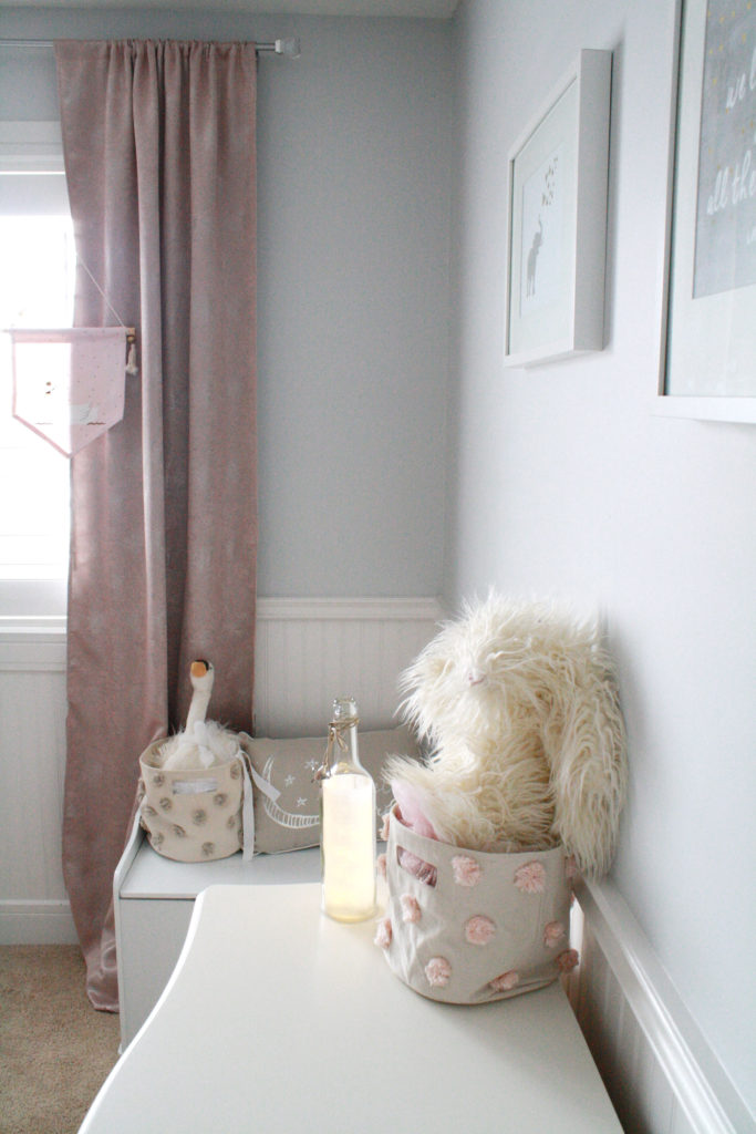 Pink and gray nursery with shimmering pink drapes 
