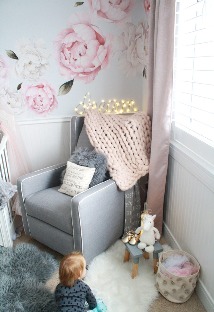 Pink and gray nursery featuring gray glider and peony wall decals