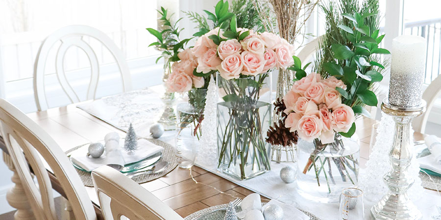 Chic Christmas Tablescape with White and Silver Accents and Pink Roses