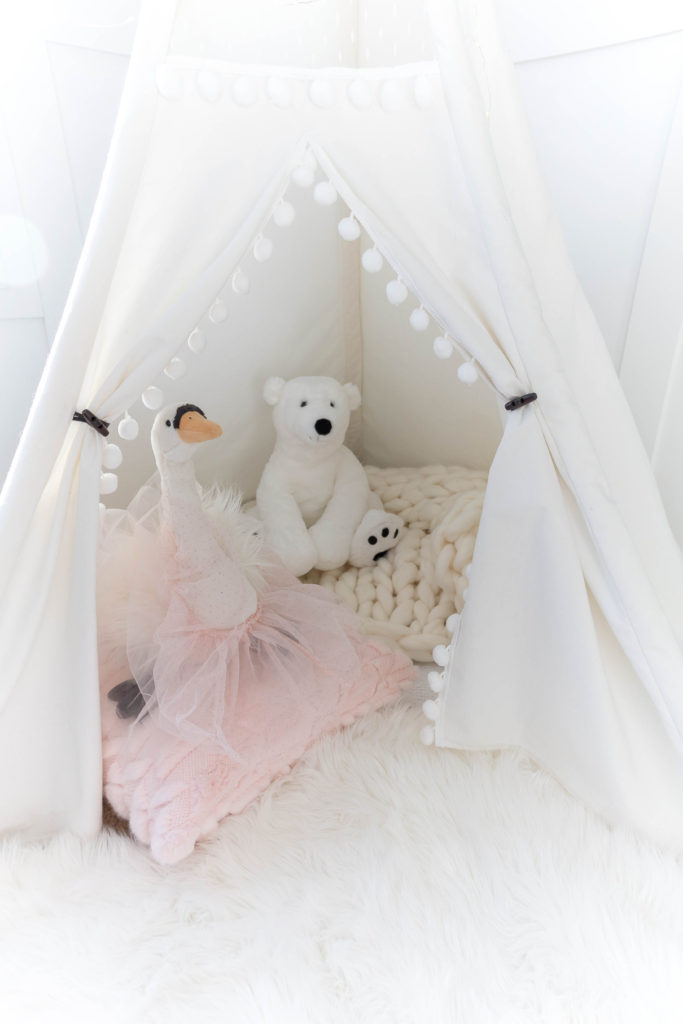Light and bright kid-friendly living room with white lace and pom pom play teepee - teepees for baby girls 