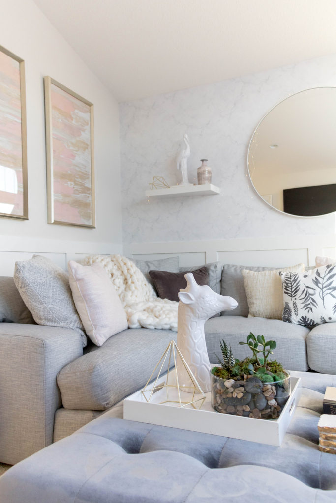 Blush pink, gray and white sitting room. Light and bright kid-friendly living room.