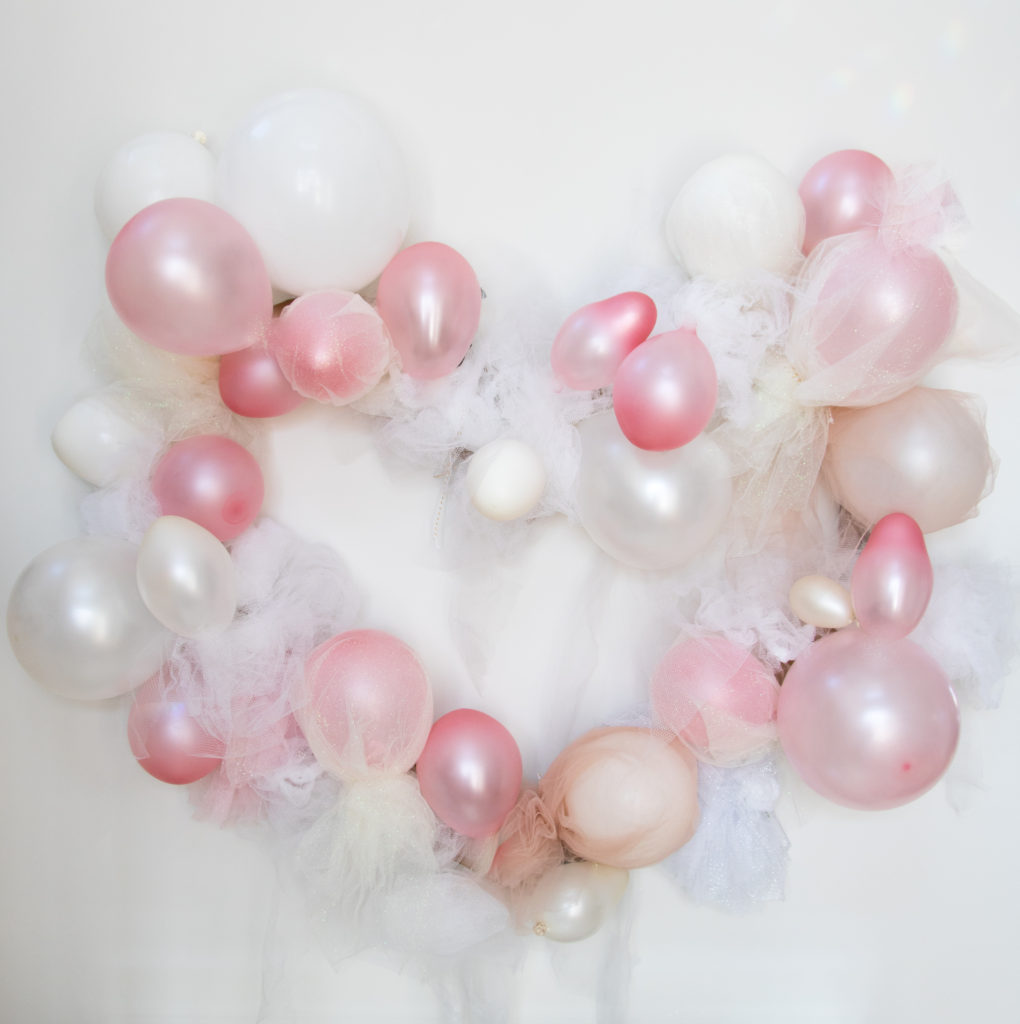 Gigantic tulle heart balloon wreath perfect for Valentine's day, baby showers, bachelorette parties and more on Chandeliers and Champagne