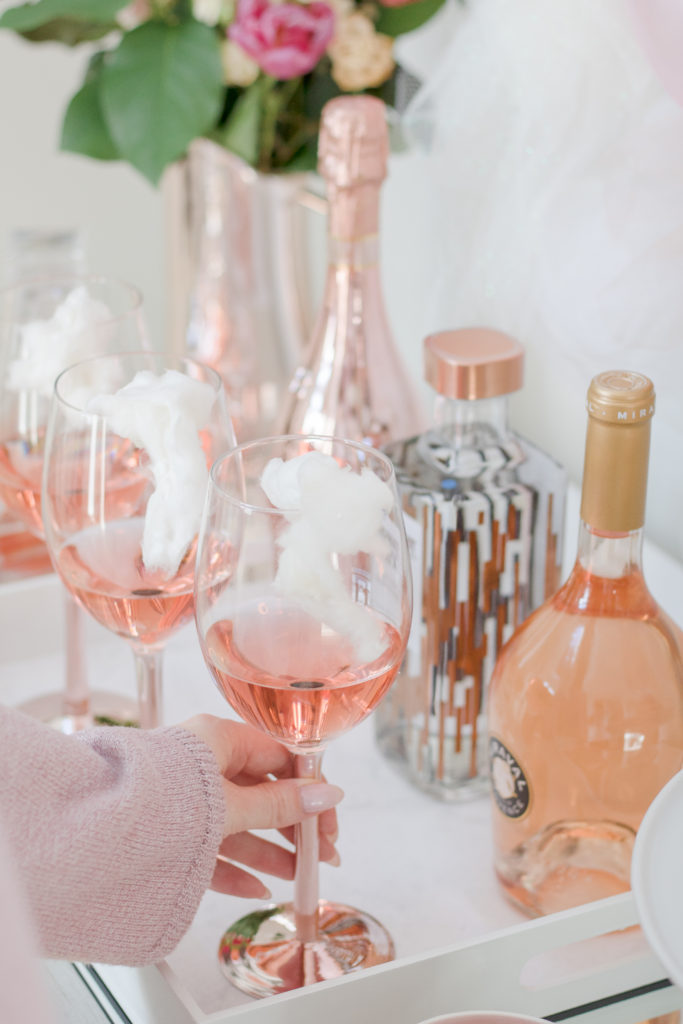 Valentine's Day bar with cotton candy rosé cocktail - Valentine's Day bar cart styling on Chandeliers and Champagne