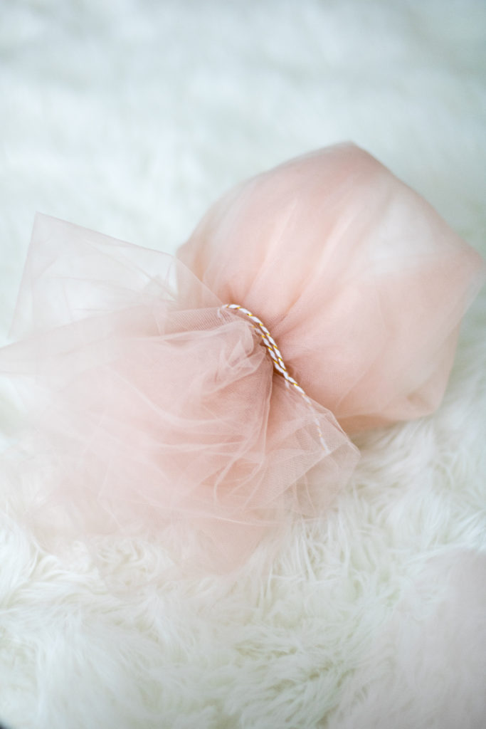 Pink tulle covered balloon on Chandeliers and Champagne