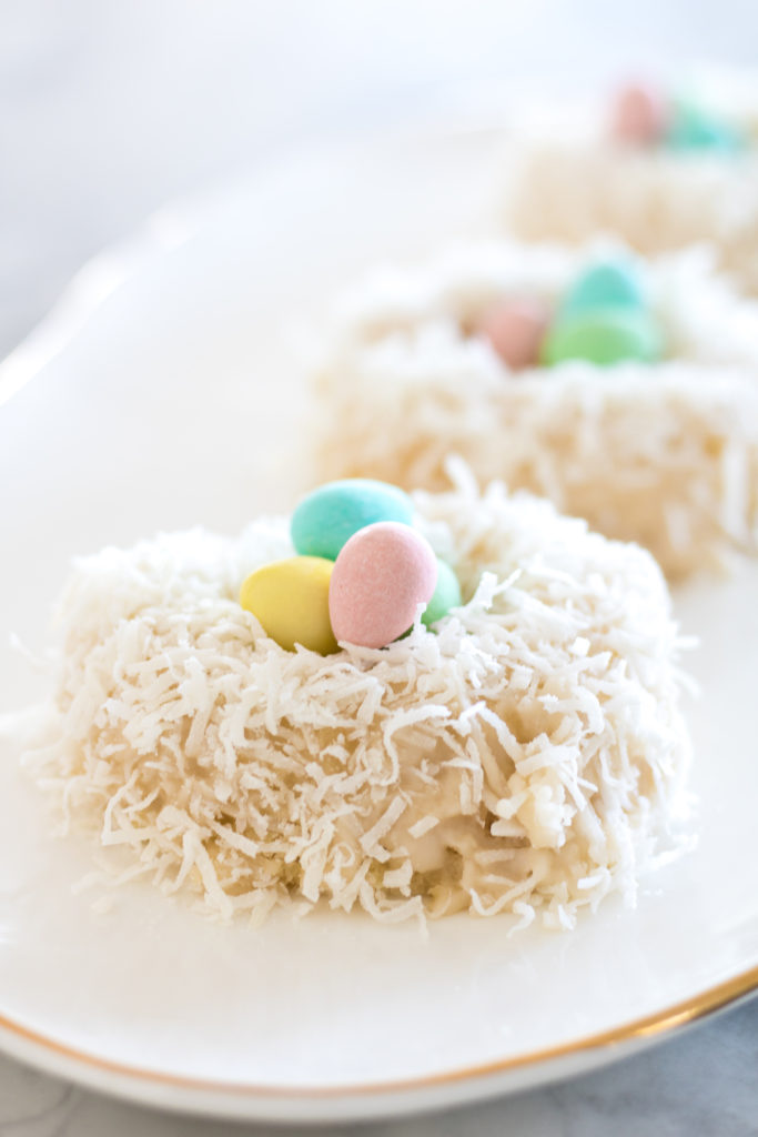 Coconut and vanilla Bird nest Easter donuts with mini eggs - Mini Eggs Bird Nest Easter Doughnuts - Fun a and Easy Easter Dessert Idea 
