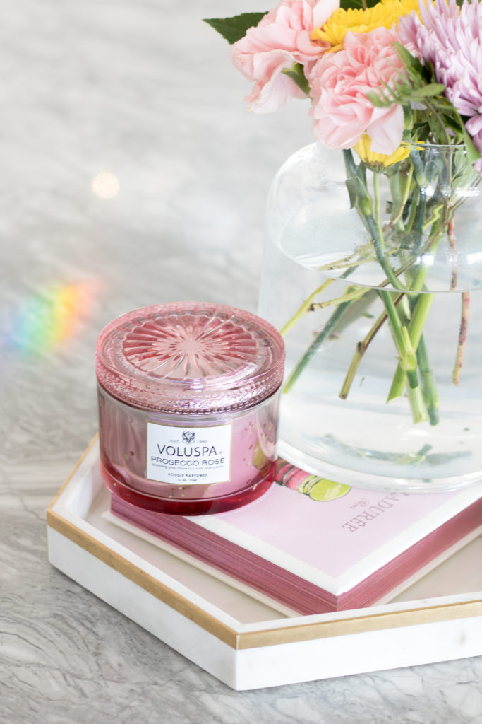 Pink kitchen accessories - pink prosecco rose Voluspa candle and pink Laduree macaron recipe book