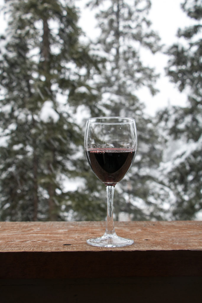 Enjoying wine on the balcony at Solara Resort and Spa in Canmore, Alberta, Canada - Rocky Mountain hotel - Canmore family trip