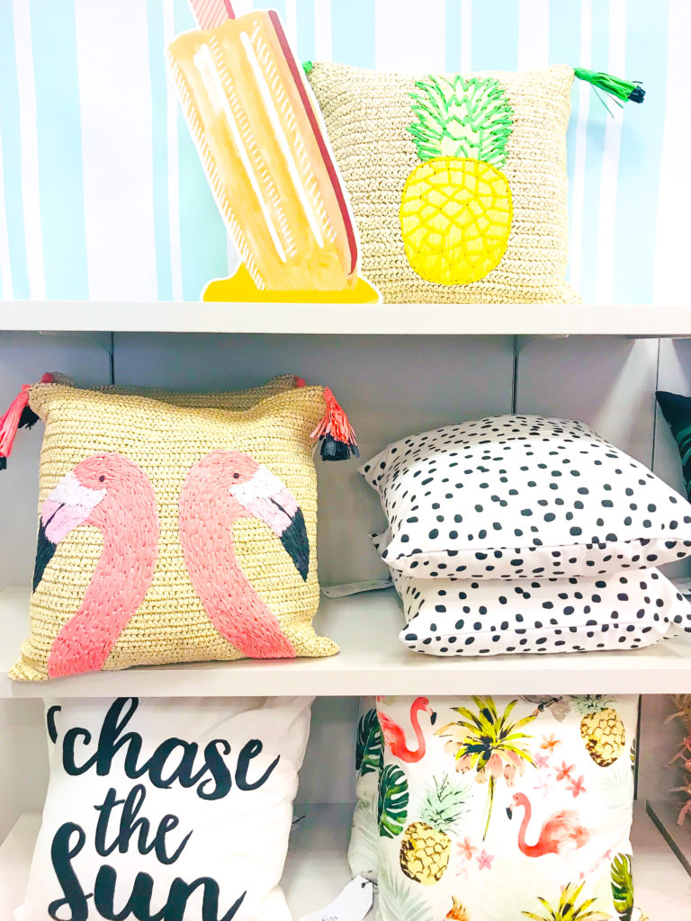 Collection of cute summer pillows at Chapters Indigo - Woven flamingo pillow - Woven pineapple pillow - Black and white polka dot pillow - Chase the sun pillow - Summer palm tree pillow