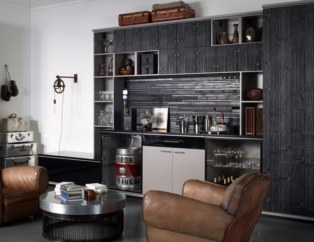 Rustic man cave with dark wood wet bar and leather accents.