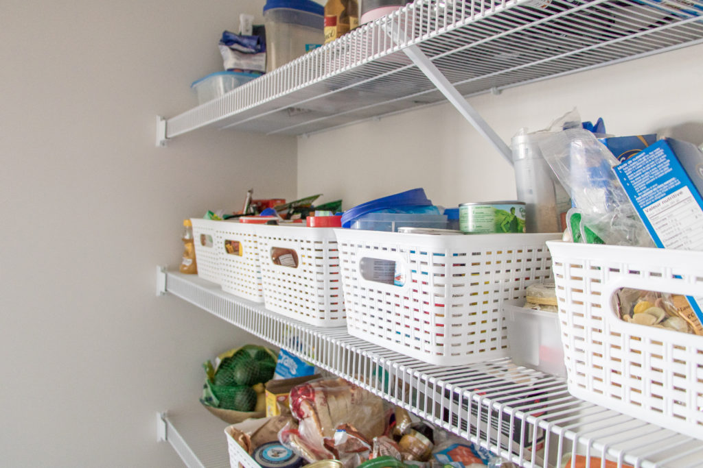 Pantry with organizational bins. Tips to segment items in your kitchen pantry. Tips to Declutter and Organize Your Walk-In Pantry