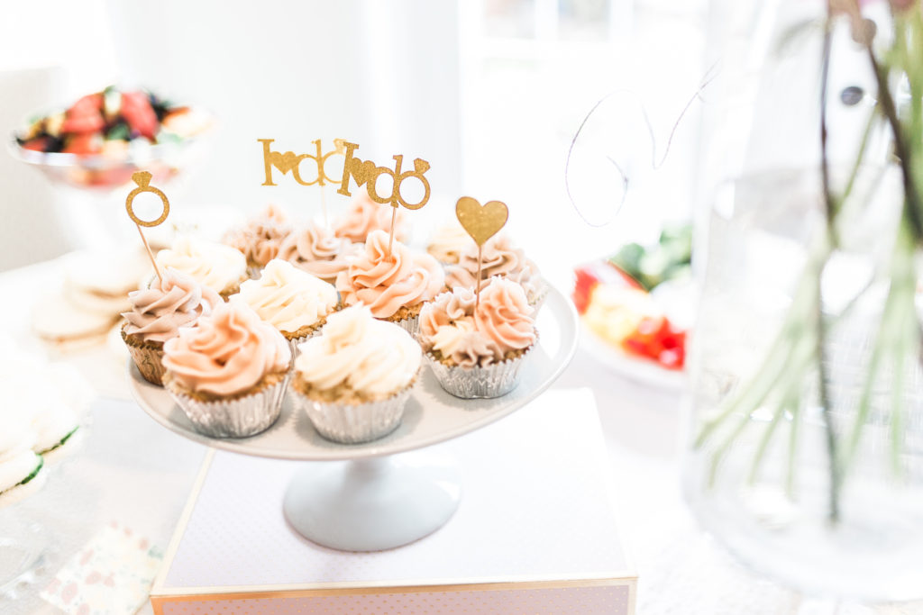Pastel piped cupcakes with I do signs • Floral Bridal Shower • Gossip Girl Bridal Shower • 