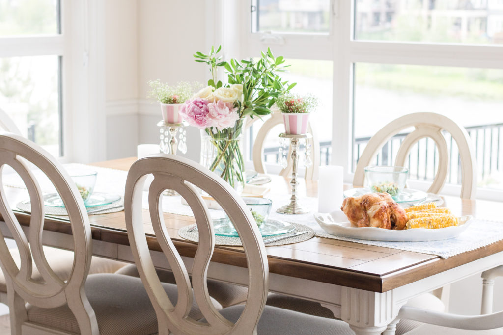 Father's Day tablescape with fresh flowers and a meal of Rotisserie Apple Wood Smoked Chicken and Hickory Smoked Sea Salt Corn