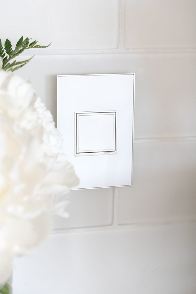 adorne Collection by Legrand Pop-out outlet with white on white wall plate - Enhancing your home with deluxe light switches and power outlets 