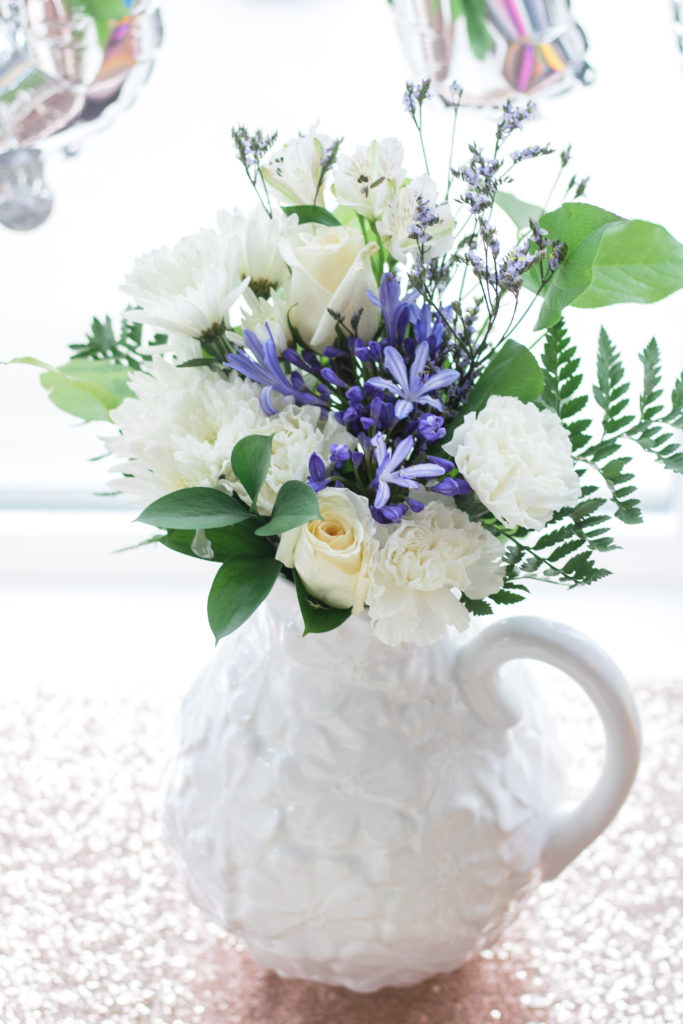 White and purple flowers with fresh greenery - Birthday party floral arrangement