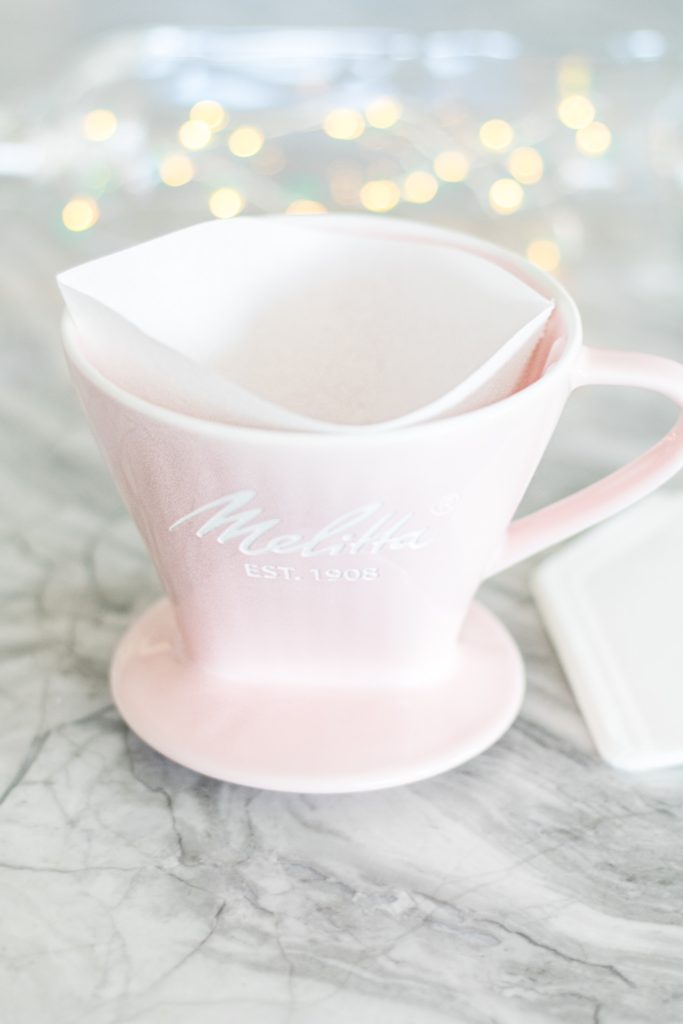 Pink ceramic Melitta pour-over coffee maker with filter and twinkle lights - Girly pink coffee makers and pink kitchen tools - Brewing the Perfect Cup of Coffee with Melitta