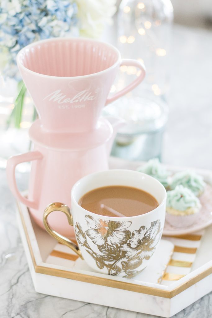 Coffee party with pink ceramic pour-over coffeemaker, gold coffee cups, cupcakes and fresh flowers - Brewing the Perfect Cup of Coffee with Melitta