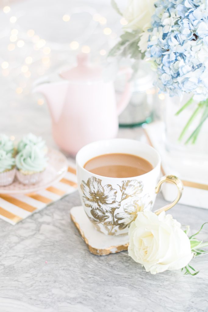 Glam and girly coffee party featuring white roses, pink Melitta pour-over coffeemaker, blue hydrangeas, fairy lights and cupcakes - Brewing the Perfect Cup of Coffee with Melitta on Chandeliers and Champagne