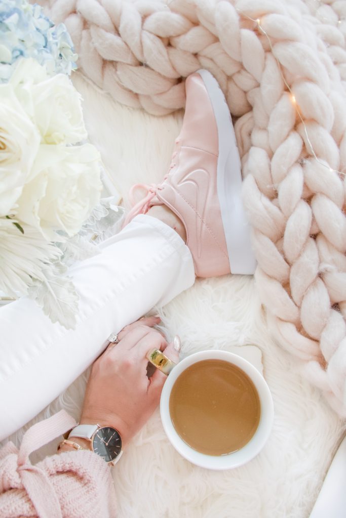 Enjoying a relaxed and cozy Melitta coffee with pink Nikes, pink merino wool blanket, white fur blanket and cozy pink knit sweater - Brewing the Perfect Cup of Coffee with Melitta on Chandeliers and Champagne