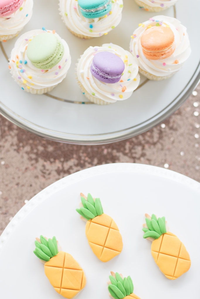 Fiesta birthday party dessert ideas - pineapple sugar cookies and macaron cupcakes - Girls birthday party ideas