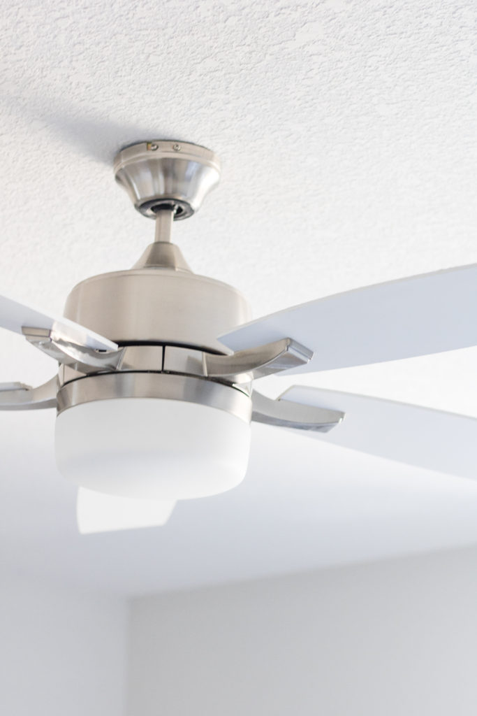 white and silver ceiling fan