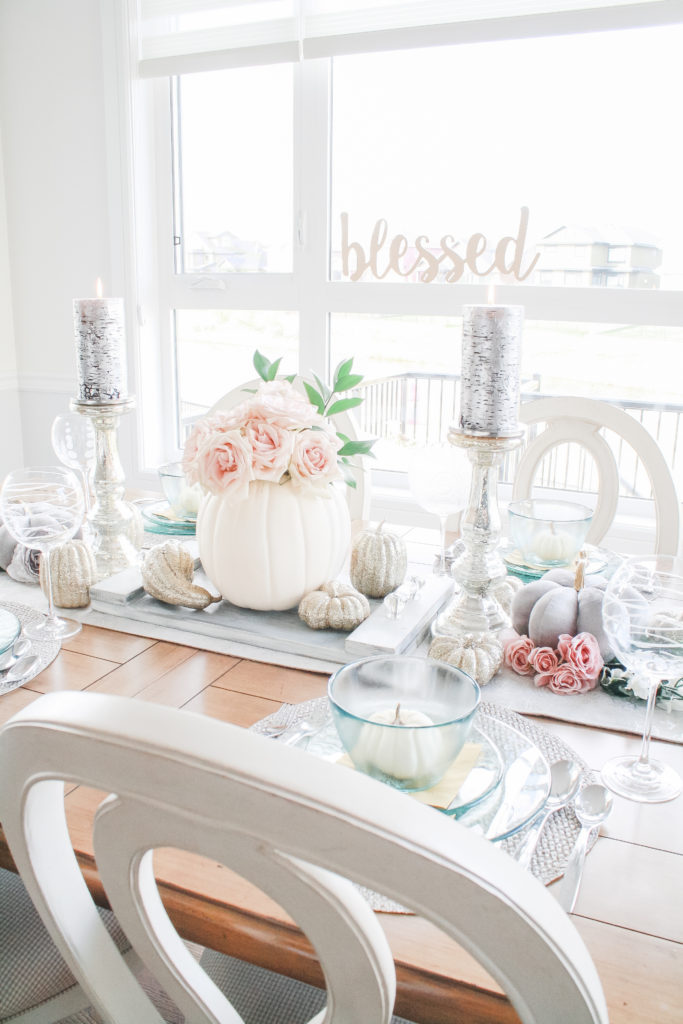 Universal Furniture Summer Hill Cotton Dining table and Summer Hill Cotton pierce back armed chairs adorned with a dazzling fall tablescape. Fall tablescape with white pumpkins centerpiece and blush roses. 
