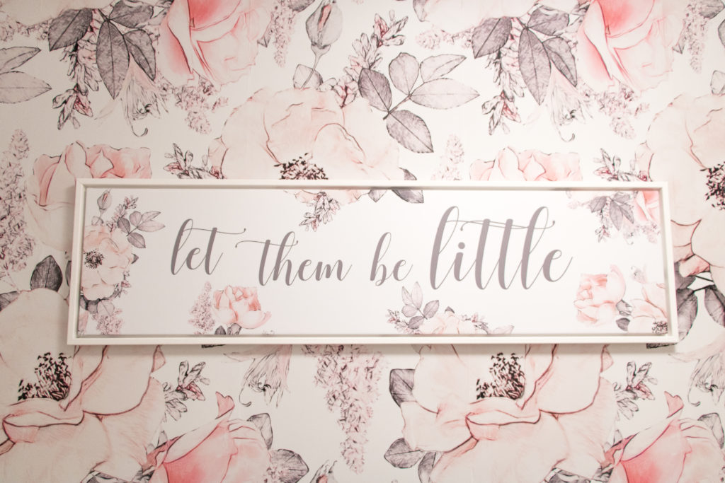 Glamorous pink playroom with custom 'let them be little' artwork by Canvas N Decor in white, pink and gray tones. Artwork ideas for baby girl nursery. Artwork ideas for girly toy room. Artwork ideas for girly playroom.