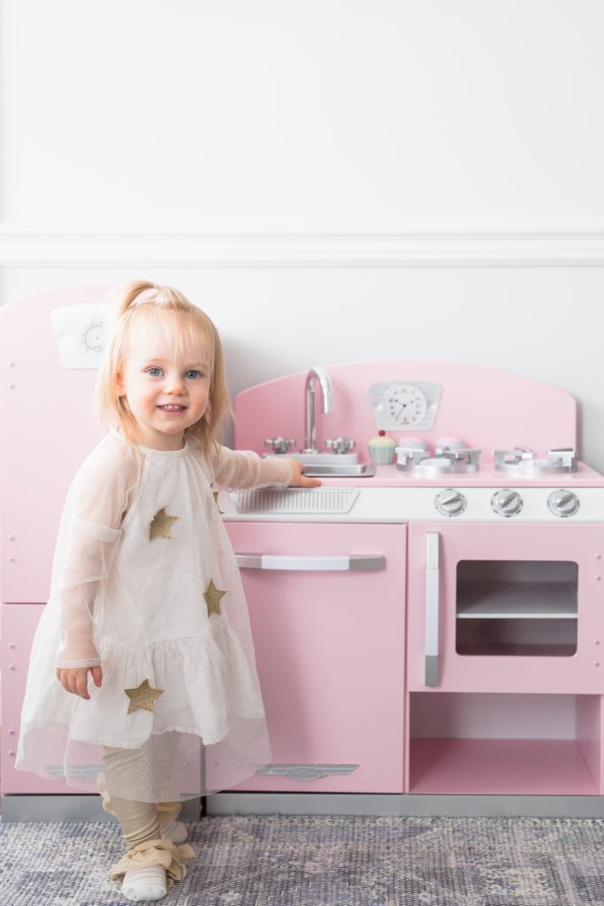 KidKraft pink retro play kitchen and fridge in our glamorous pink playroom. Pink play kitchens for girls. Play kitchen for girls.