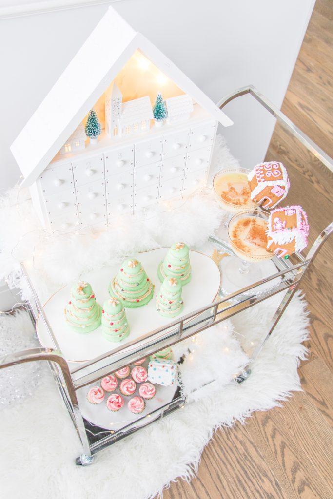 Christmas dessert bar cart with twinkle lights and white accessories, Christmas cocktail styling ideas, Christmas entertaining bar cart