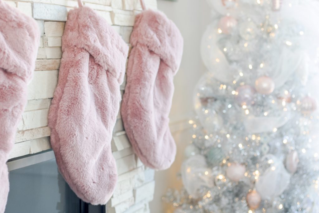 Blush pink fur Christmas stockings with white ombre Klaus Christmas tree from Urban Barn, pastel Christmas decor