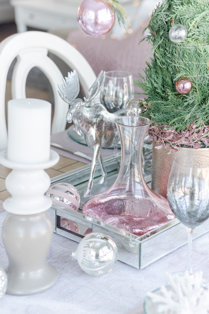 Pink Christmas table decor with shimmering pink decanter, silver moose, gray candlesticks and Grinch tree