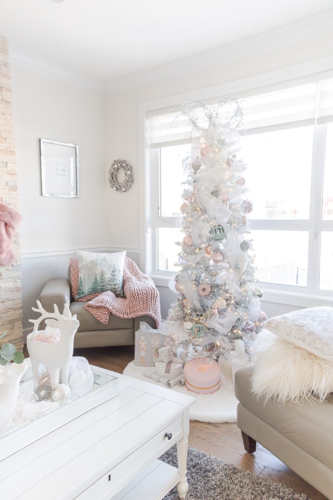 Pretty pastel Christmas decor with pink stockings, pink Christmas tablescape, white ombre Christmas tree, feminine Christmas decor ideas, glamorous Christmas decorating