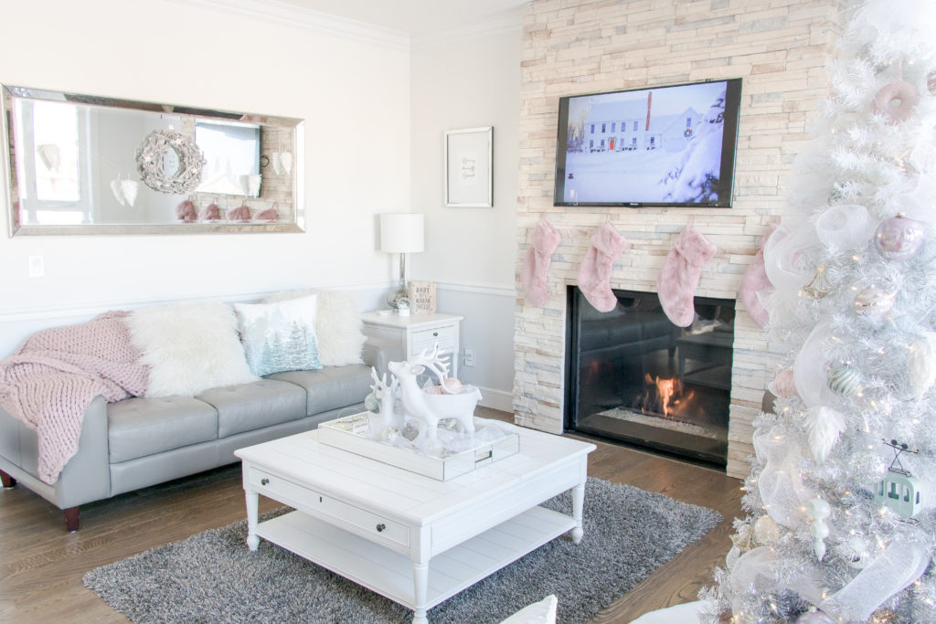 Pretty pastel Christmas decor with pink stockings, pink Christmas tablescape, white ombre Christmas tree, feminine Christmas decor ideas, glamorous Christmas decorating