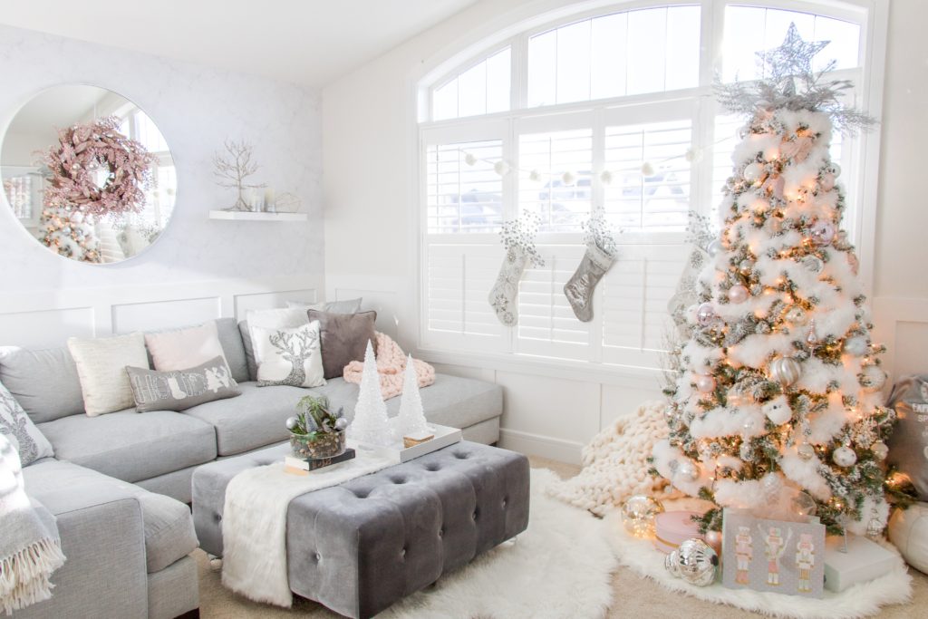 Living room with white fluffy Christmas tree and pastel holiday decor