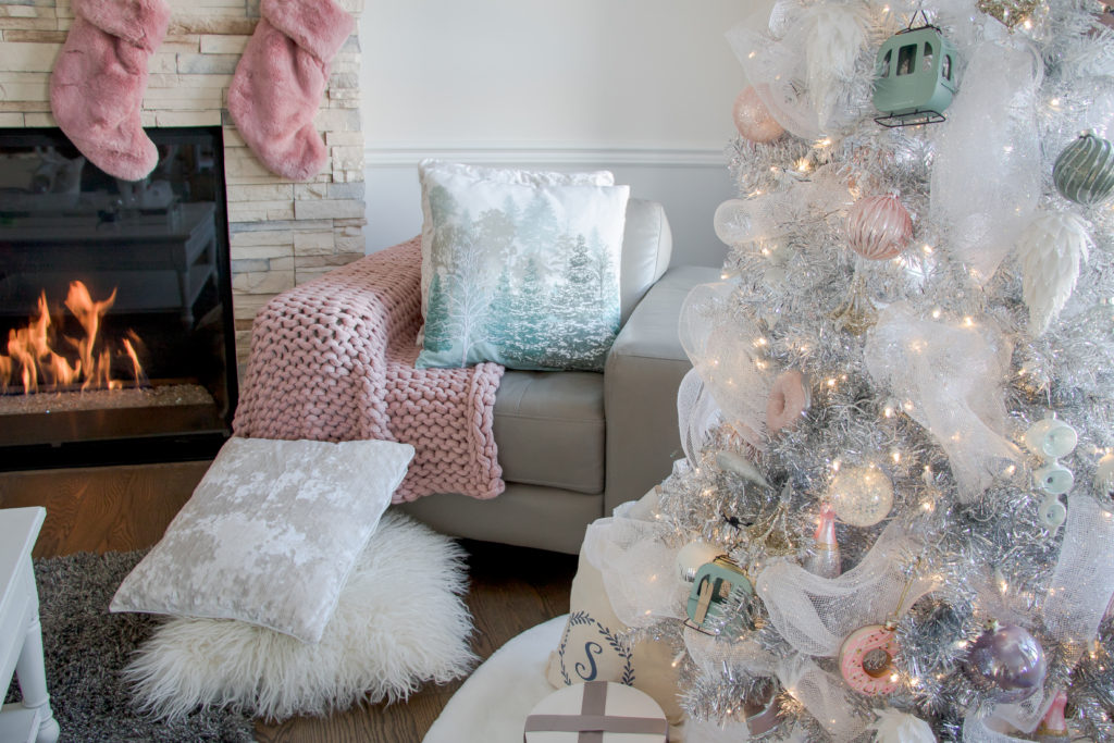 Plush and cozy fur Christmas decor ideas - white fur tree skirt - pink fur Christmas stockings