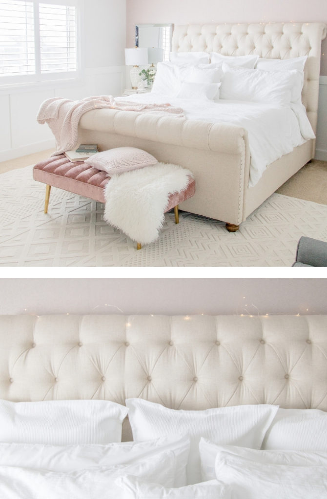 Light and bright bedroom decor featuring pink wallpaper, classic white bedding and tufted beige bed