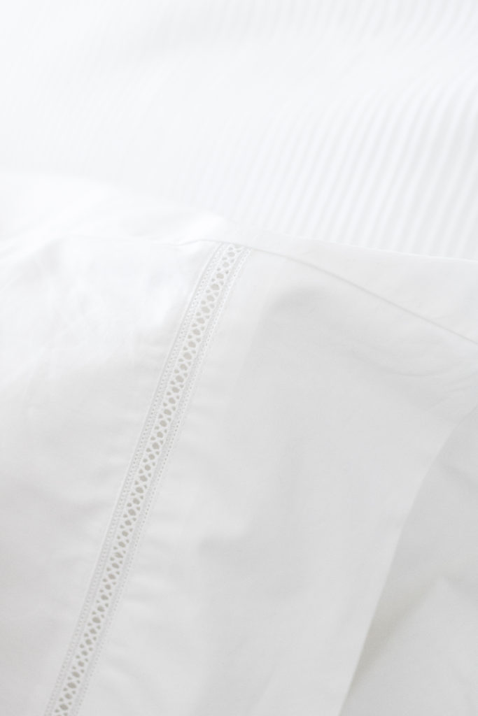 Crips classic white bedding and classic white pillowcases from GlucksteinHome add elegance to my bedroom