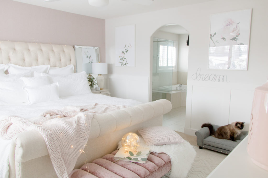 Relaxing bedroom design ideas: neutral colour palette with a pop of pink and classic white bedding by GlucksteinHome