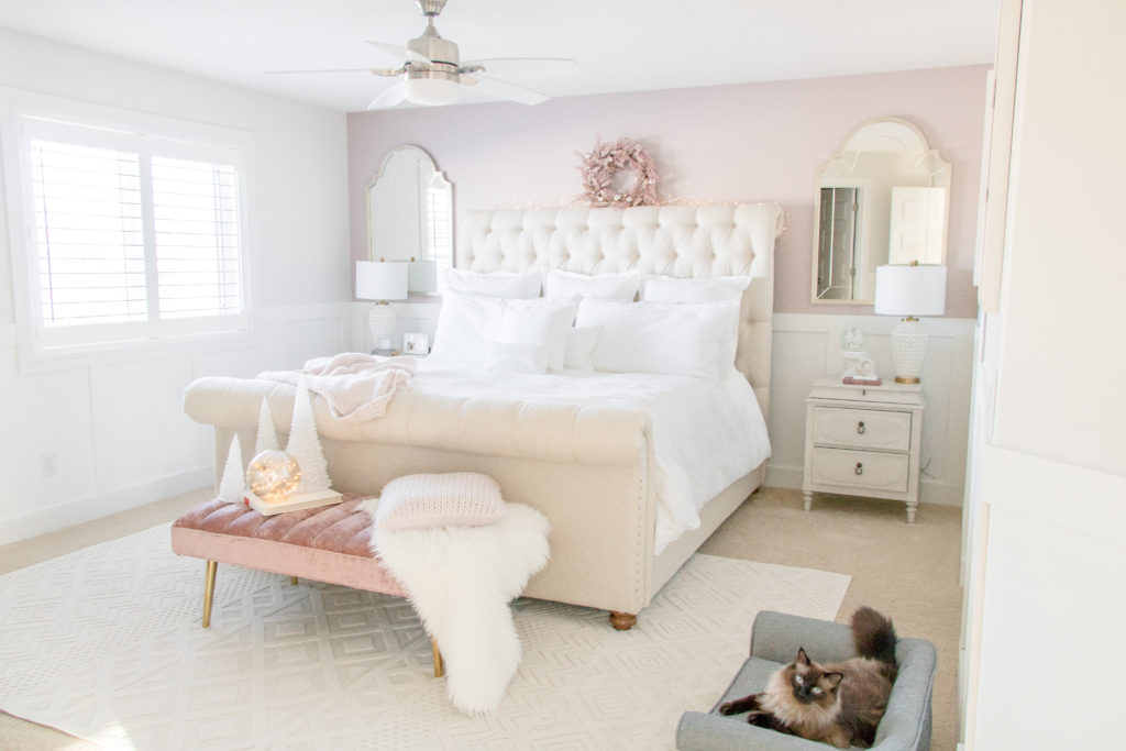 Glamorous and feminine bedroom with a cat sofa - blush pink bedroom design ideas