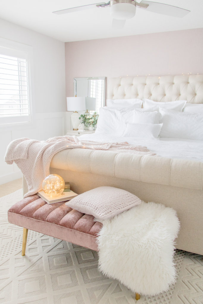 Glam bedroom decor ideas: velvet millennial pink details with classic white bedding and beige tufted sleigh bed