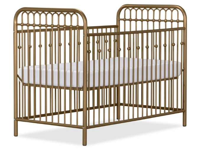 Gold nursery inspiration: Gold crib, brushed brass crib part of white and grey gender-neutral nursery 