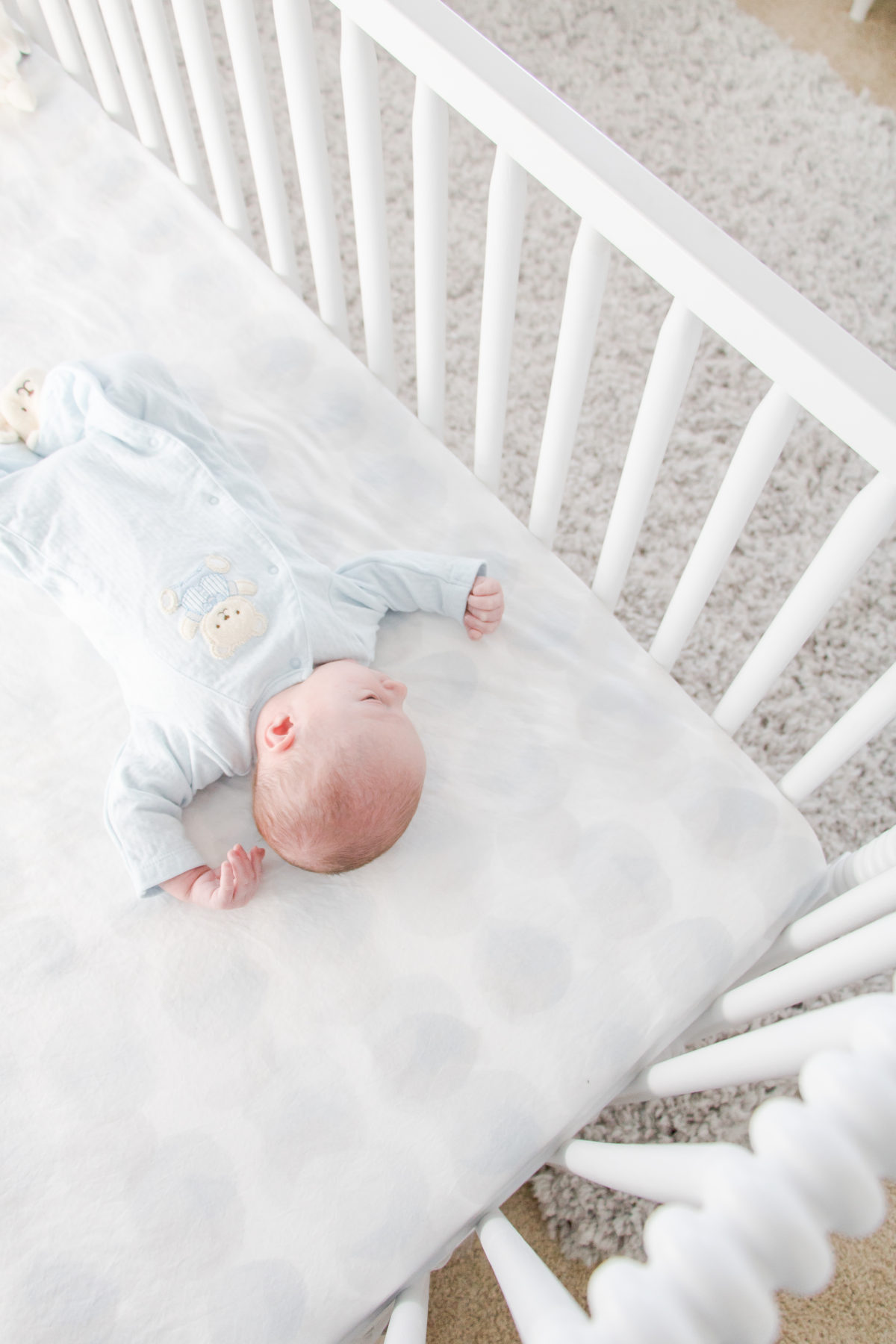 White and Grey Gender-Neutral Nursery • Chandeliers and Champagne