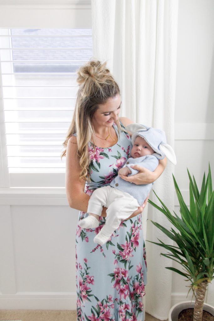 New Mom wearing floral print dress with baby boy in bunny sweater - 10 Cute Dresses for Toddler Moms