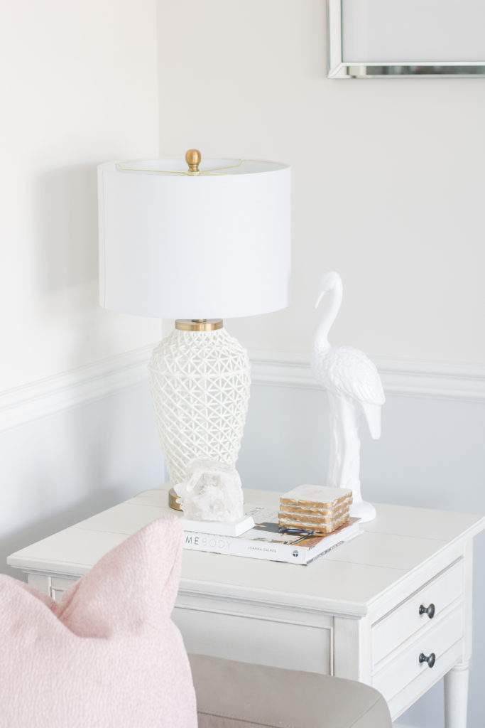 Living room side table styled with a white lamp and table top decor: Pastel Living Room Decor
