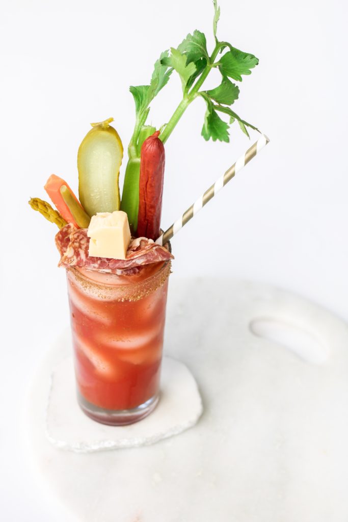 Charcuterie gin caesar topped with lots of fun fixings