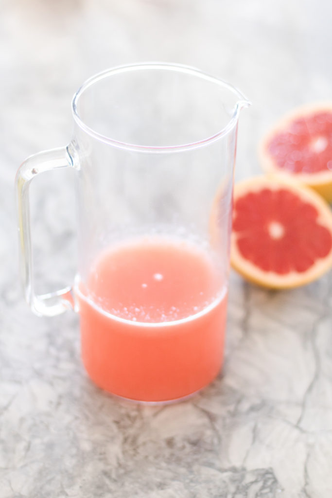 Closeup shot of fresh squeezed grapefruit juice 